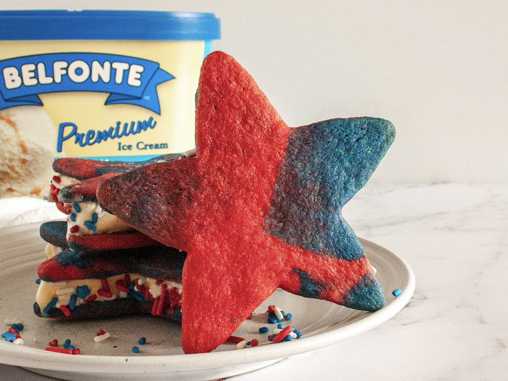 red white and blue cookie on a plate with carton of Belfonte ice cream in background